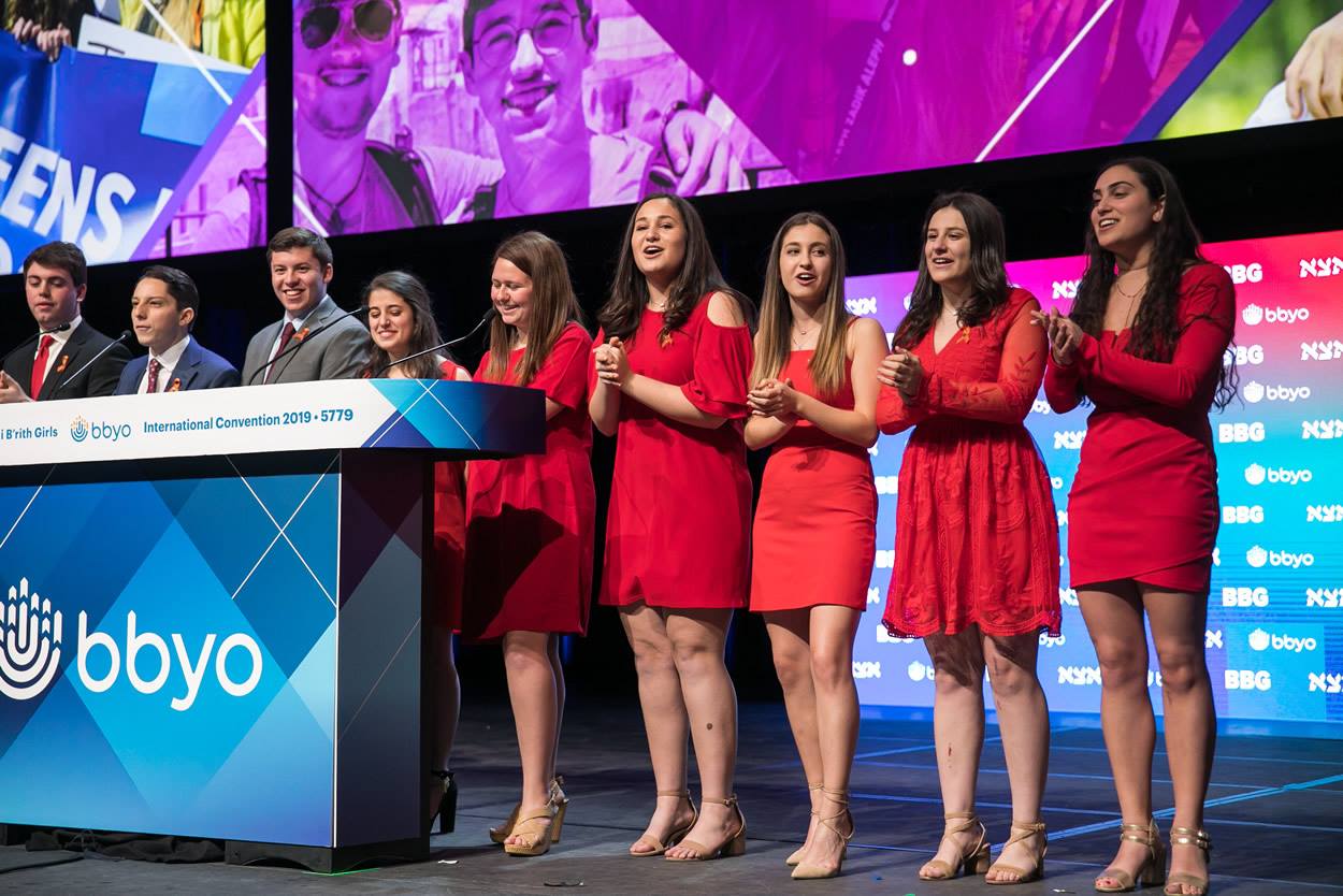 Group of people celebrating on stage
