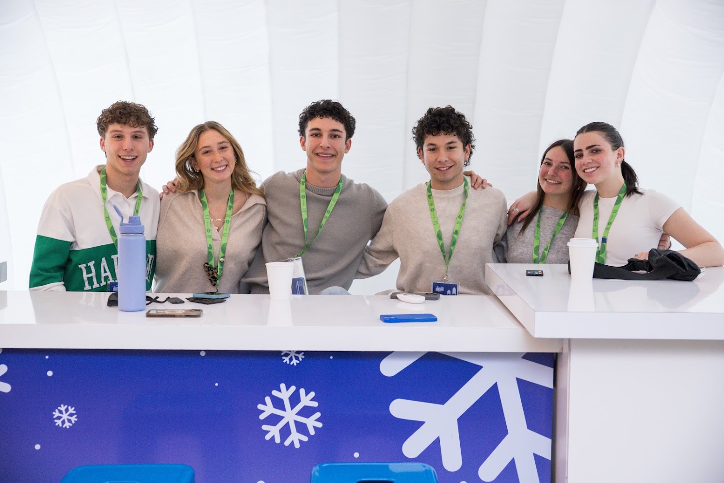 Group of diverse young people smiling at a community event