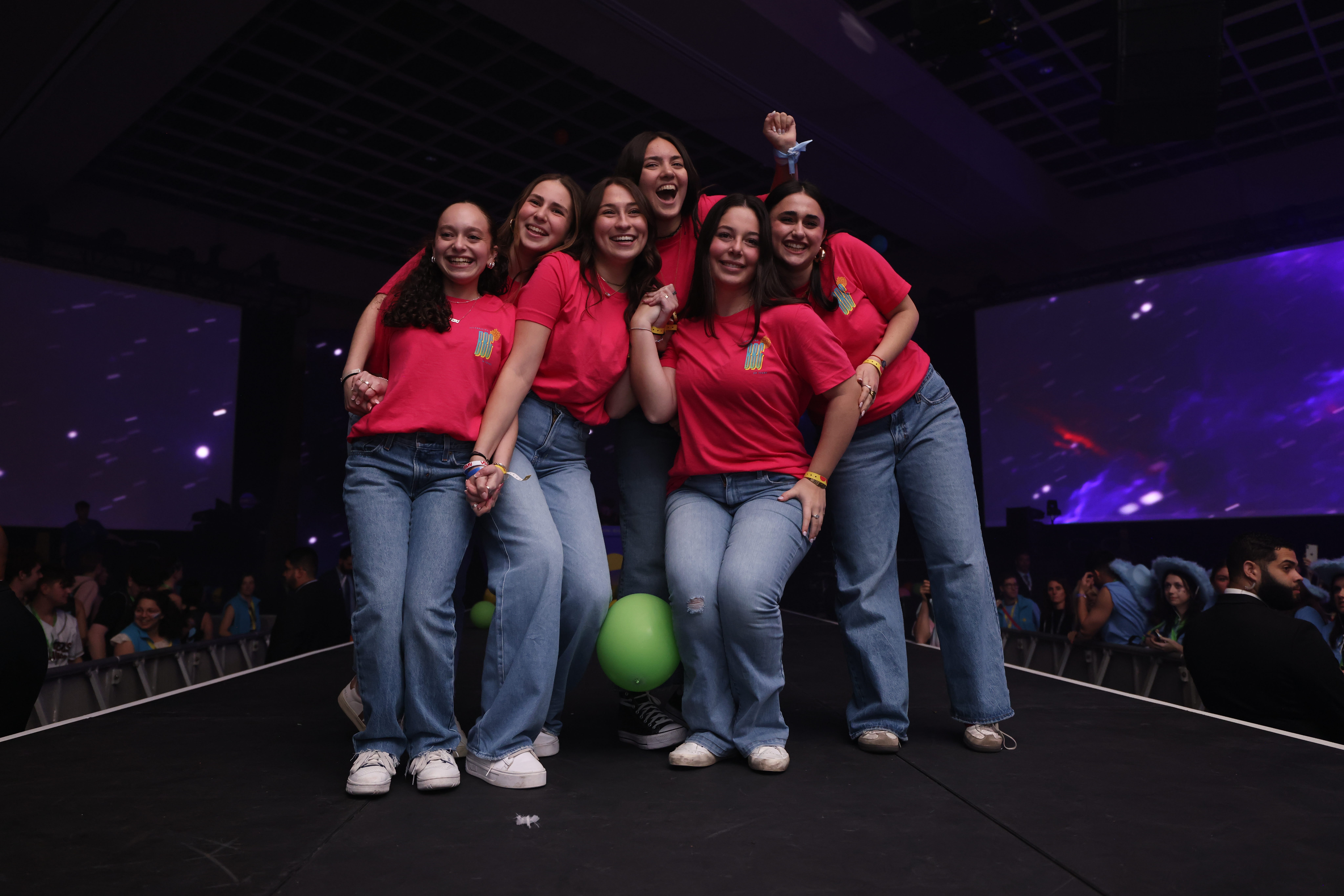 Group of people celebrating on stage