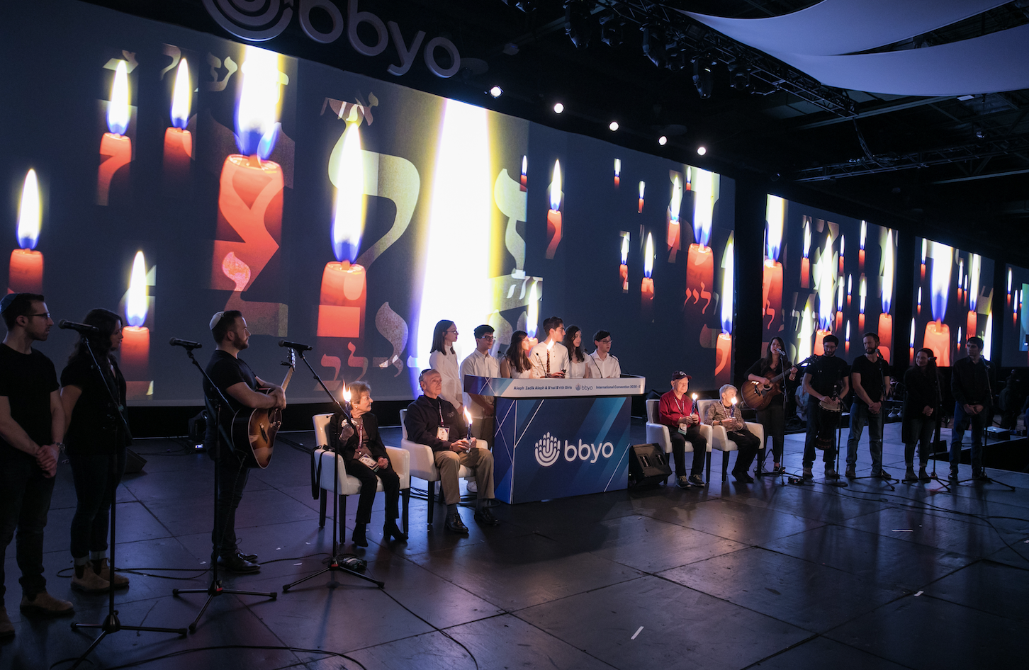 Group of people celebrating on stage
