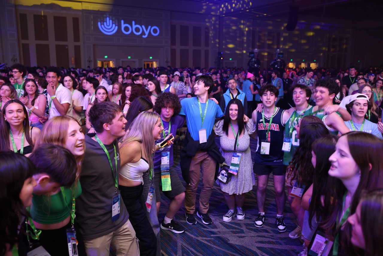Group of people celebrating on stage