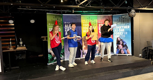 Group of people celebrating on stage