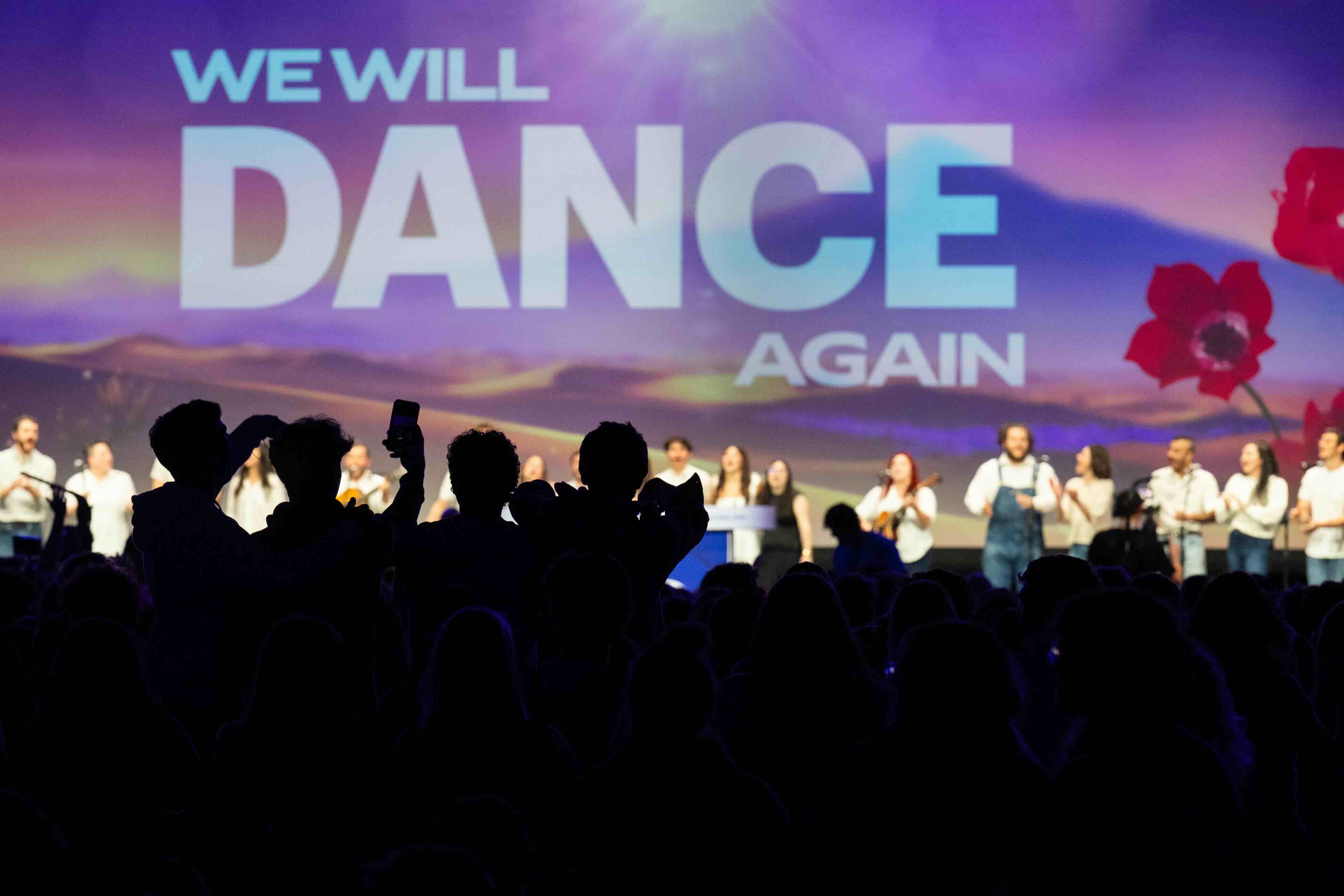 Group of people celebrating on stage